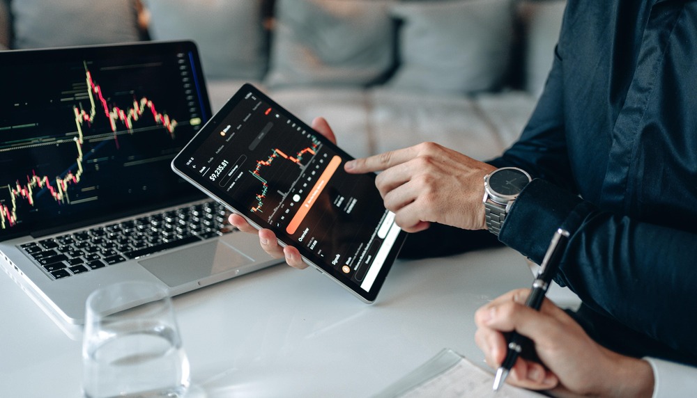 Smartphone and a laptop with a trading platform